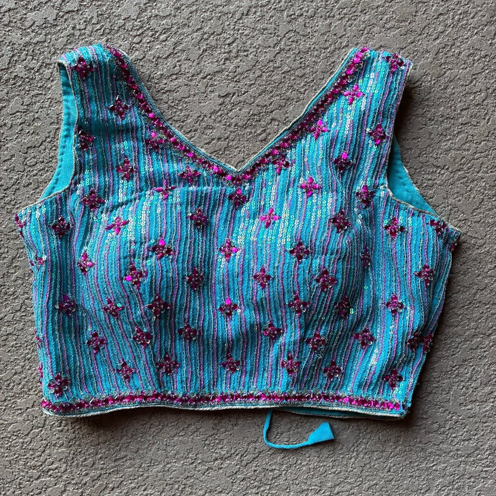 Sleeveless or short sleeve aqua chiffon choli with pink rhinestones